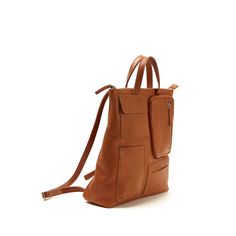 Natural grain, vegetable tanned leather backpack. Four different size pockets in front, one big pocket on the back, division inside. Adjustable straps and lined with printed fabric. Height: 14.1" Width: 11.8" Depth: 4.3" Cognac Leather Backpack For Everyday Use, Modern Brown Backpack For On-the-go, Everyday Use Cognac Backpack, Cognac Leather Travel Backpack, Brown Leather Backpack For Commuting, Daily Use Standard Backpack In Cognac, Cognac Leather Standard Backpack, Everyday Cognac Backpack With Leather Lining, Modern Brown Backpack For Commuting