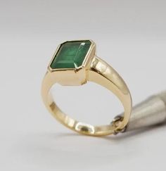 Classic Jewelry With Emerald Cut Bezel Setting, Classic Emerald Cut Jewelry With Bezel Setting, Classic Emerald Cut Bezel Set Jewelry, Green 14k Gold Signet Ring With Bezel Setting, Timeless Green Rings With Bezel Setting, Formal Bezel-set Baguette-cut Emerald Ring, Formal Baguette Cut Emerald Ring With Bezel Setting, Green Signet Ring With Bezel Setting For Wedding, Green Bezel Set Signet Ring For Wedding