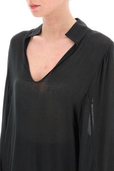 Loose blouse By Malene Birger crafted in lightweight see-through viscose and wool canvas, featuring stand collar, V neck and wide kimono sleeves. The model is 177 cm tall and wears a size EU 36. Composition: 80% Viscose 20% Wool Silk Long Sleeve Blouse For Layering, Chic Flowy Blouse With Split Neck, Chic Flowy Split Neck Blouse, Elegant Viscose Tunic For Summer, Chic V-neck Tunic For Workwear, Modern Long Sleeve Summer Blouse, Sheer V-neck Blouse For Work, Fall Sheer V-neck Blouse, Chic Viscose Tunic Tops