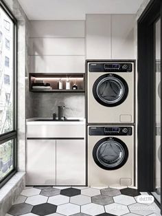 a washer and dryer in a small room next to a window with the door open