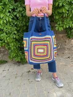 In stock! Granny Square extra large size blue bag is made of cotton yarn. Combined with rainbow summer colors, the bag has a very large interior volume. It is the perfect accessory for those who love big bags. Although it is a very large bag, it is very light and does not take up space. *Please contact for different sizes*          Bag sizes          Width 60 cm / 23.6 inches          Length 50 cm / 19.6 inch          It is lined.         washing information         It can be washed in the hand Blue Bohemian Shoulder Bag With Granny Square Details, Blue Bohemian Shoulder Bag With Granny Square, Bohemian Blue Shoulder Bag With Granny Square Details, Blue Cotton Beach Bag For Vacation, Blue Bohemian Bag For Shopping, Blue Bohemian Square Shoulder Bag, Blue Square Vacation Bag, Square Blue Vacation Bag, Blue Crochet Bag With Large Capacity For Travel