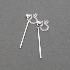 Long Silver Bar Invisible Clip On Earrings, Silver Stick Clip On Earrings Dangle, Non Pierced Earrings, Simple Minimal Line Clip-On Earrings 🌟More pierced look and comfortable invisible clip on earrings are available at MiyabiGrace home page. Please click the link below https://www.etsy.com/shop/MiyabiGrace 🌟More invisible clip on hoop earrings: https://www.etsy.com/jp/shop/MiyabiGrace?show_panel=true&section_id=25146523 Details ◆Short : Length:1.1 inches (2.8 cm) ◆Long : Length:1.45 inche Minimalist Silver Clip-on Jewelry, Minimalist Nickel-free Metal Clip-on Earrings, Minimalist Adjustable Silver Clip-on Earrings, Minimalist Clip-on Earrings For Gifts, Nickel-free Minimalist Drop Clip-on Earrings, Minimalist Dangle Plug Earrings With Matching Pair, Minimalist Nickel-free Drop Clip-on Earrings, Minimalist Silver Hypoallergenic Clip-on Earrings, Silver Minimalist Hypoallergenic Clip-on Earrings