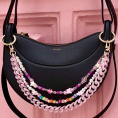 👜 Want to make your handbag unique? Discover my handmade bag chains from Paris, the perfect accessory to add style and personality to your look. Turn your handbag into a jewel with a touch of Chappell Roan! With a practical clasp and ring options, my chains easily attach to almost any bag. ❣️ First Lodzé bag chain? ❣️ For handles where clasps don't fit, don't forget to select the clip rings 7). * Features: Trio of beaded and acrylic chains: Fancy bead chain: 34cm/13.38" Message chain: 36cm/14.1 Pink Chain Bag For Gift, Pink Bag Charm Keychain For Everyday Use, Handmade Pink Bag For Personal Use, Pink Bags With Chain Strap As Gift, Pink Bags With Chain Strap For Gifts, Pink Bag With Chain Strap As Gift, Pink Shoulder Bag With Chain Strap For Gift, Pink Shoulder Bag With Chain Strap As Gift, Junk Purse