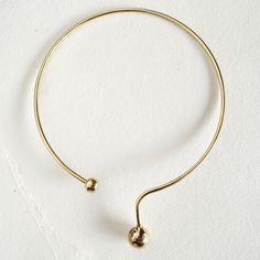 Solid Brass Simple Drop sphere circle  design choker collar necklace. Bisjoux Exclusive. Arrives in logo drawstring protective pouch. Visible molten metal format organic imperfections which add to the nature of this handmade necklace. Gold Minimalist Choker With Adjustable Length, Minimalist Gold Choker With Adjustable Length, Adjustable Brass Chain Choker, Adjustable Brass Choker With Chain, Minimalist Adjustable Circle Necklace, Modern Adjustable Choker Necklace, Minimalist Adjustable Brass Necklace, Modern Circle Necklace With Adjustable Fit, Handmade Minimalist Metal Choker