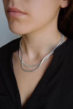 Flat snake chain, layering silver necklace, minimal silver necklace, flat snake chain, herringbone silver necklace, flat choker necklace Flat snake chain made in sterling silver ideal for layering or to use by itself :) Lenght:  40 cm/15,7 in 42 cm/16,5 in 45 cm/17,7 in Thickness: 42 mm/0,16 in The model is wearing the 42cm and 45cm lengths in the first pictures ♥ * For reasons of hygiene exchanges and returns of earrings will not be accepted. * Every item arrives inside a nice jewelry gift box Long Bar Earrings, Flat Snake Chain, Chain Layering, Triple Hoop Earrings, Diamond Jewelry Earrings, Stick Earrings, Silver Choker Necklace, Layered Necklaces Silver, Silver Choker