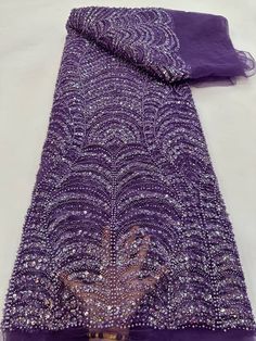 This high quality Fabric is measured in 5 Yards With Embroidered Beading and Sequin. It is soft, very delicate and beautiful. This high Quality Fabric is made with Fashion embroidered rhinestones can be used in making party wedding dresses, skirts, shawls, scarves and other other fashion apparels as you would like. Size : Length : 5 yards (180 inch). Width: 50 inch (Please allow slight deviation for the measurement data ,±1 inch) Material: 100% Polyester, Tulle Lace Fabric, Eco-Friendly embroide Beaded Party Dress, Beaded Tulle, Luxury Fabric, Pretty Beads, Popular Dresses, African Beads, Purple Lace, Sequins Embroidery, Tulle Lace