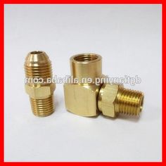 three brass fittings on white background