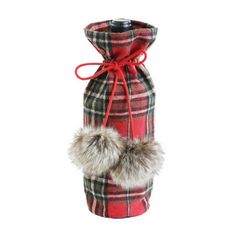 a red and black plaid wine bottle with a fur ball in the top, on a white background