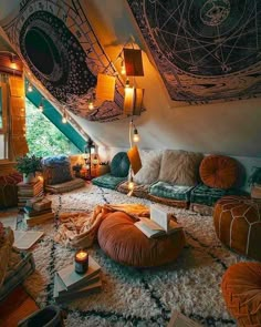 a living room filled with lots of furniture under a skylight next to a window