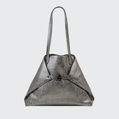 Akris metallic shoulder bag in hammered leather. Approx. 18.50"H x 12.20"W x 5.12"D; 11.42" drop. Two flat shoulder straps. Open top. Folded sides secure at turn-lock front. Interior, two zip pockets. "AI" is imported. Metallic Elegant Shoulder Bag For Everyday, Elegant Metallic Shoulder Bag For Everyday Use, Elegant Everyday Metallic Shoulder Bag, Modern Silver Shoulder Bag For Business, Luxury Metallic Shoulder Bag For Shopping, Chic Silver Shoulder Bag For Business, Luxury Metallic Shoulder Bag With Palladium Hardware, Modern Metallic Shoulder Bag For Everyday, Luxury Metallic Tote Shoulder Bag