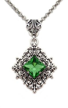 This is a new handmade pendant. It is made with antiqued silver plated filigrees, featuring a high quality LIGHT PERIDOT GREEN glass rhinestone/jewel that sparkles like crystal. Pendant measures 2 1/4" tall (including the decorative bail) and 1 3/8" wide and is worn on a sturdy rolo chain in your choice of length.This is also available in a variety of stone colors in our store, along with matching earrings. Prom Aesthetic, Victorian Filigree, Goth Steampunk, Antique Silver Necklace, Filigree Necklaces, Gothic Victorian, Peridot Green, Choker Pendant, Bridesmaid Wedding