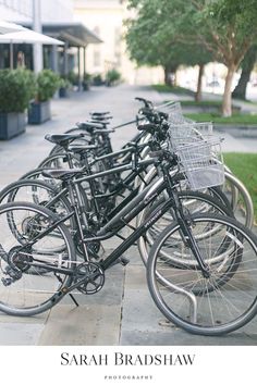 there are many bikes parked on the sidewalk