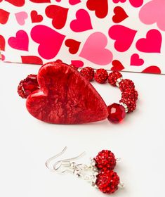 "Rhinestone bead bracelet and earrrings are perfect for that special occasion or as a fun Valentine's Day gift for her. This large heart beaded jewelry set is sure to make a shining statement! Heart beaded bracelet and earrings * Valentines day gift for her * Heart Size:  1.5\" H x 1.5\" W  * Bracelet Length 6.75 inches, Message for a different length * Matching red glitter earrings included * Jewelry set will be shipped next business day MORE HEART JEWELRY https://www.etsy.com/shop/MiksJewelryS Heart-shaped Beaded Bracelet For Valentine's Day, Adjustable Heart-shaped Beaded Bracelets For Valentine's Day, Valentine's Day Heart-shaped Adjustable Beaded Bracelets, Red Heart-shaped Bracelets For Valentine's Day, Valentine's Day Heart-shaped Stretch Bracelet With Colorful Beads, Heart Jewelry Set, Red Beaded Bracelet, Gift Sets For Her, Creative Diy Gifts