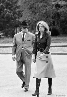 black and white photograph of man and woman walking