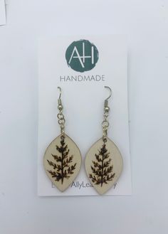 Very cute, wood burned by hand wooden fern earrings  Made with gold plated rings and natural wood  Wooden part is sealed and finished  Fun & classy! Handmade Gold Wooden Jewelry, Handmade Wooden Gold Jewelry, Handmade Natural Wood Earrings As Gift, Handmade Natural Wood Earrings For Gift, Handmade Wooden Earrings For Everyday, Nature-inspired Natural Wood Earrings As Gift, Nature-inspired Natural Wood Earrings For Gift, Handmade Wooden Earrings For Everyday Wear, Everyday Handmade Wooden Earrings