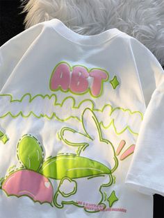 This Kawaii Rabbit Print T-Shirt is made from a blend of breathable cotton and durable polyester, making it perfect for everyday casual wear. With a cute rabbit design, this T-Shirt is sure to put you in a good mood. White Cartoon Print T-shirt For Spring, White T-shirt With Cartoon Print For Spring, Casual Spring T-shirt With Cute Design, Cute White T-shirt With Bunny Design, Cute Cartoon Print Crew Neck T-shirt, Cute Crew Neck T-shirt With Cartoon Print, Kawaii Character Print T-shirt For Spring, Spring Kawaii T-shirt With Funny Print, Cute White T-shirt For Streetwear