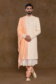 Peach sherwani featuring bead, sequin hand work in floral pattern. Paired with a sleeveless kurta, can orange churidar and embellished hem dupatta. - Aza Fashions Fitted Peach Traditional Wear With Zari Work, Anarkali Style Sherwani With Resham Embroidery In Art Silk, Peach Traditional Wear For Reception With Traditional Drape, Peach Traditional Wear For Reception, Traditional Drape Peach Wear For Reception, Peach Traditional Drape For Reception, Anarkali Sherwani With Zari Work In Straight Kurta Style, Traditional Peach Wear With Zari Work In Traditional Drape, Anarkali Sherwani With Zari Work