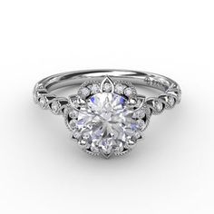 a white gold engagement ring with an oval center stone surrounded by round brilliant cut diamonds