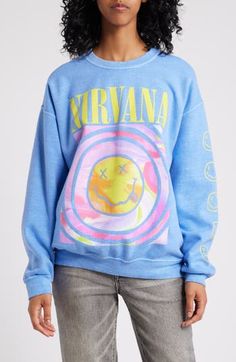 Add a heavy dose of '90s style to your look with a slouchy garment-washed sweatshirt dominated by a Nirvana graphic. Crewneck Long sleeves Dropped shoulders Ribbed cuffs and hem 50% cotton, 50% polyester Machine wash, tumble dry Imported Trendy Washed Sweatshirt For Streetwear, Trendy Washed Sweatshirt For Spring, Trendy Acid Wash Sweatshirt For Streetwear, Fall Acid Wash Grunge Sweatshirt, Blue Grunge Top For Fall, 90s Graphic Print Fall Sweatshirt, Trendy Acid Wash Sweatshirt For Fall, Oversized Blue Washed Sweatshirt, Acid Wash Streetwear Sweatshirt With Screen Print