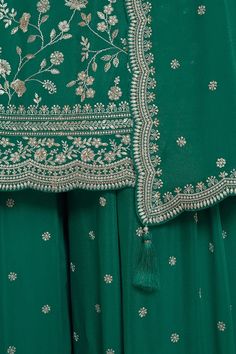 Get ready to turn heads with this Green Floral Pattern Embroidered Palazzo Suit Set! Expertly crafted with intricate embroidery, sequins, and resham thread work, this palazzo style salwar suit is the epitome of chic style. A matching bottom and dupatta finishes off the look with perfection. 3 piece with lining (Top, Bottom, Dupatta) Kameez chinon silk with heavy embroidery work Palazzo chinon silk with embroidery front and back Dupatta chinon silk with four side lace and all over embroidery work