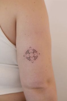 a woman with a small tattoo on her arm