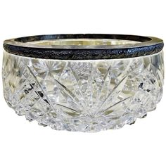 a crystal bowl with black trim around the rim