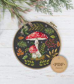 a cross stitch pattern with a mushroom on it