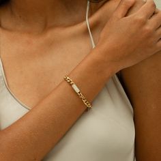 DESCRIPTION & DETAILS Anja Bracelet is a classic and statement piece meant to go solo or with any watch or bracelets. With more classy looks from its center charm design. You can never go wrong with this piece that is best paired with its collection our “Anja Collection”. Plating: 14k Gold Materials: 14K Gold on Stainless Steel, AAA Grade Freshwater Pearl Measurements: Length: 170mm+50mm﻿ Hypoallergenic SUSTAINABILITYIn-house plating - All pieces are hand crafted by our in-house jewellers ensuri Elegant Stainless Steel Bracelets With Rectangular Links, Elegant Stainless Steel Bracelet With Rectangular Links, Elegant Gold Bracelet With Rectangular Links In Stainless Steel, Elegant White Chain Bracelet, Minimalist Formal Bracelet With Extender, Elegant White Chain Bracelet With Solid Link, Elegant Everyday Chain Bracelet With Extender, Everyday Elegant Chain Bracelet With Extender, Minimalist Bracelet With Extender For Formal Occasions