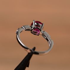 It is a lab ruby ring. The main stone is 7mm*7mm round cut, weight about 1.66 carats. The basic metal is sterling silver and plated with rhodium. To change the metal to a solid gold (white/rose) or platinum is also available, please ask for a quotation if you want. You can also go to my shop Home for more elegant rings: https://www.etsy.com/shop/godjewelry?ref=hdr_shop_menu More ruby rings: https://www.etsy.com/shop/godjewelry?ref=seller-platform-mcnav§ion_id=20709238 Customization is always wel Lab-created Ruby Promise Ring With Round Band, Silver Cubic Zirconia Ruby Ring With Round Band, Silver Ruby Ring With Prong Setting, Sterling Silver Ruby Promise Ring, Silver Ruby Ring With Cubic Zirconia, Sterling Silver Ruby Ring With Accent Stones, Silver Ruby Birthstone Ring, Lab-created Ruby Birthstone Ring With Gemstone, Ruby Ring With Bezel Setting For Promise