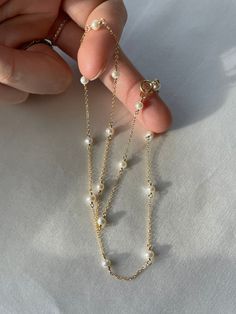 "- Handmade in USA - 14k Gold Filled or Sterling Silver - Smooth White Pearls - 100% Natural Gemstones, No Heat or Dye - AAA Gemstones - Can Be Gift Wrapped PRODUCT INFO Gorgeous bright White gemstones wire wrapped in delicate 14k gold fill or sterling silver chain front to back. This infinity design is one that we feel represents our jewelry aesthetic really well. We love the dainty chain in between the beautiful stones since it really makes each stone stand out which shows off their color and Dainty 14k Gold-filled Pearl Chain Jewelry, Dainty 14k Gold Filled Pearl Chain Jewelry, Everyday 14k Gold-filled Pearl Necklace With Delicate Chain, Delicate Akoya Pearl Necklace With Delicate Chain, Dainty 14k Gold Filled Pearl Necklace For Everyday, Dainty Akoya Pearl Jewelry With Pearl Charm, Dainty Akoya Pearl Charm Jewelry, Delicate Akoya Pearl Jewelry With Delicate Chain, Elegant Double Strand 14k Gold Filled Necklaces