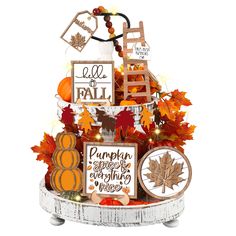 a basket filled with fall decorations on top of a table