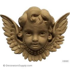 a statue of a child's head with wings