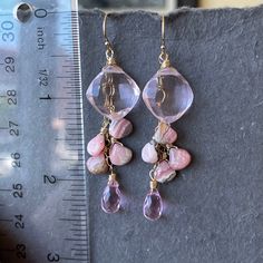 Generously sized Pink faceted cushion cut quartz on a 14k gold filled chain anchors sweet Rhodocrosite and pink quartz. The total length is apprx 2.”. This listing includes 14k gold filled French ball earwires shown, but if you desire the leverback option, please select them from the drop down menu. Your earrings will arrive beautifully giftboxed. To see these and many designs on video, please visit my instagram page. It’s connected conveniently at the bottom of the home page here. Faceted Briolette 14k Gold Filled Jewelry, Pink Dangle Jewelry With Faceted Beads, Pink Wire Wrapped 14k Gold-filled Jewelry, Pink 14k Gold-filled Wire Wrapped Earrings, Pink 14k Gold-filled Dangle Jewelry, Nickel-free Pink Drop Jewelry, Pink Gemstone Dangle Jewelry, Pink 14k Gold Filled Dangle Jewelry, Pink Rose Quartz Jewelry With Ear Wire