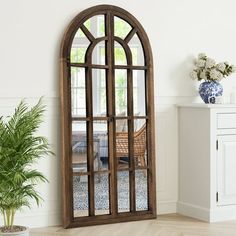 This modern full length mirror brings arched window style to any room. The 71-inch by 32-inch frame features a premium wooden design to blend seamlessly with your decor while providing years of reliable use. Behind the frame is an HD imaging 5mm MDF backboard for a distortion-free reflection so you can check your outfit from head to toe. Whether you're getting ready for the day,styling your hair,or simply admiring your outfit,this floor mirror helps you see yourself in a whole new light. The arc Arched Window Mirror, Full Length Floor Mirror, Farmhouse Mirrors, Wood Arch, Mirror Wall Living Room, Brown Floors, Full Length Mirror Wall, Arch Mirror, Window Mirror