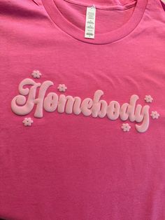 Stay comfortable and stylish in our Homebody T-shirt with puff letters design. Made with eco-friendly materials, this unisex shirt is soft and cozy, perfect for lazy days at home or a casual outing. Embrace your inner homebody with this must-have wardrobe staple! How to Order: 1- Pick size and color shirt 2- Add to cart and go to cart 3-in the instructional box enter: puff color 4-Check out