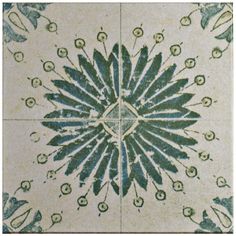 an artistic tile design in green and white