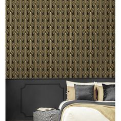 an art deco wallpaper design in gold and black, on a bed with pillows