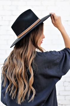 Ok, we're freaking out! The Joshua Hat is our newest favvvvv. It's everything a girl could dream of in a hat. Incredible quality, a pointed rancher crown, super structured, and an elastic inner-band. Black is always in style and you'll be in love. The elegant crown is stiffened and shaped into a clean and ridged design, finished with a braided trim. It's timeless, will last forever, and adds the perfect touch of coolness to any look. -Rancher style hat with some edge -Incredible quality -Brim is Black Flat Crown Fedora For Kentucky Derby, Black Fedora With Flat Crown For Spring, Black Fedora With Flat Crown For Fall, Black Felt Hat With Flat Crown For Ranch, Black Brimmed Fall Costume Hat, Black Brimmed Costume Hat For Fall, Brimmed Black Costume Hat For Fall, Trendy Curved Brim Fedora For Festival, Adjustable Fedora Costume Hats For Fall