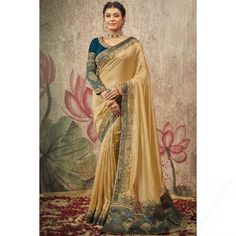 A stylish interpretation of ethnic glamour and contemporary style, this dark beige crepe saree will surely make a statement. This round neck and 3/4th sleeve blouse is perfectly formed using lace, patch, pearl, and woven zari work. It is available with a crepe light weight saree in dark beige color elaborated using lace and patch work. This blouse can be customized up to the maximum size available in inches 44 around the bust. Silk Saree Blouse, Red And Orange, Chiffon Saree, Fancy Sarees, Traditional Sarees, Indian Ethnic Wear