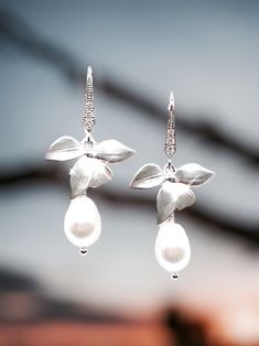 "Orchid Bridal Earrings Pearl Earrings Flower bridesmaid Earrings bridesmaid gift Orchid Earrings Wedding gift Bridal Jewelry gift for Her Looking for the perfect gift for your bridesmaids? These Orchid Bridal Earrings are the perfect way to say thank you on your special day. Made with high-quality pearls, these earrings are both elegant and timeless. The delicate orchid flower design adds a touch of whimsy to any bridal outfit. These earrings make a great gift not only for bridesmaids but also Flower Bridesmaid, Bridal Pearl Earrings, Orchid Necklace, Orchid Earrings, Orchid Wedding, Beadwork Necklace, Cocktail Jewelry, Wedding Pendant, Christmas Necklace