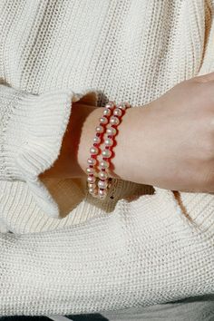 What a gentle, sweet feeling emanates from this delicious ‘peach’ shade of pearls! Adding a touch of garnet-red between pearls is like adding the word ‘love’ to a sentence. Bringing joy to your eyes and a healing touch to your wrist, this bracelet amplifies its purpose with double strands. Stones: Freshwater pearls, garnet Material: 14k gold-filled Length: 7" + 1.5" extender Pearl Charm Beaded Bangle Bracelet As Gift, Beaded Bangle Bracelet With Pearl Charm As Gift, Gift Beaded Bangle Bracelet With Pearl Charm, Elegant Red Pearl Bracelets, Red Pearl Bracelets With Round Beads, Red Pearl Bracelet As Gift, Red Pearl Bracelet As A Gift, Red Pearl Bracelet Gift, Spiritual Pearl Bracelet With 8mm Beads