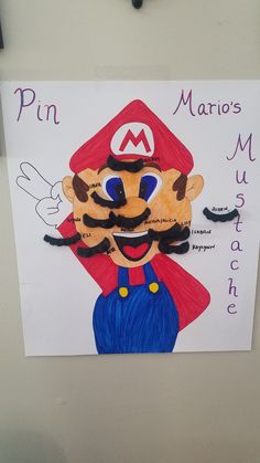 a paper cut out of mario's face on a bulletin board that says pin mario's mushroom