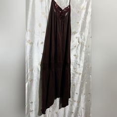 This One Was A Little Difficult To Photograph On A Hanger But This Was The Best I Could Do So Far! It's A Never Worn Maroon Like Color Peplum Style Handkerchief Hem Drop Waist Dress By Guess With Adjustable Spaghetti Straps And Pretty Embroidered Lace Panel In The Front Center Piece. Size Is Small But It Can Fit Most Mediums, Cotton Blend With A Little Bit Of Stretch To Fabric Nwot Sleeveless Cotton Dress For Night Out, Sleeveless Sundress For Night Out, Sleeveless Cotton Mini Dress For Party, Sleeveless Cotton Sundress For Party, Sleeveless Cotton Midi Dress For Night Out, Sleeveless Cotton Dress For Date Night, Brown Sleeveless Cotton Dress, Sleeveless Cotton Mini Dress For Date Night, Sleeveless Cotton Midi Party Dress