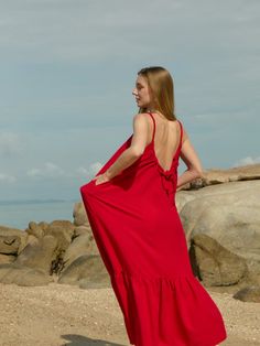 Discover our limited edition Olivia Maxi Dress. This red dress perfectly blends style, comfort, and versatility, effortlessly transitioning from day to night with its maxi length. It features an adjustable scoop back, rope detail straps, and ruffles for a chic vacation vibe. Features: Maxi length Side pockets Adjustable scoop-back Lightweight feel Viscose- French silk Handmade in Thailand, designed in the U.S Care instructions: Hand washing recommended or gentle machine wash with low heat dry Re Red Ruffled Maxi Dress For Beach, Red Ruffled Maxi Dress For Vacation, Vacation Dress With Adjustable Straps In Red, Red Vacation Dress With Adjustable Straps, Red Beach Dress With Adjustable Straps, Red Spaghetti Strap Maxi Dress With Ruffles, Red Maxi Dress With Ruffles And Spaghetti Straps, Chic Red Maxi Dress For Beach Season, Red Spaghetti Strap Maxi Dress For Beach