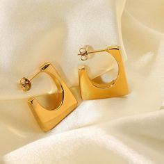 Embrace bold style with Geometric Earrings, artfully crafted in 18k gold-filled. These earrings feature a striking mix of geometric shapes, perfect for adding a contemporary and artistic touch to any fashion-forward ensemble. Modern Gold Plated Square Jewelry, Modern Gold Square Earrings, Modern Square Gold Earrings, Modern Square Yellow Gold Hoop Earrings, Gold Modernist Earrings, Contemporary Everyday Gold Jewelry, Elegant Yellow Gold Earrings, Contemporary Rectangular Gold Jewelry, Gold Geometric Earrings For Everyday