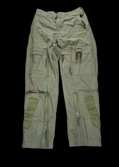 These are Vintage 1980s Military issued Cargo pants, Tons of pockets and details these are super unique and will complement any outfit! Faded Sun Burned Olive and Non Faded Available!..  Product Photos are the non faded pair.. Photos on Model are the Sun burned faded olive Pair! Please Let us know your preference before ordering! 🤟🏼 1980s Tactical Military Trousers Size / All sizes Available  Color: Vintage Olive  Please note all items are examined to the best of our ability. Most items are 20+ years old and are not in perfect condition small imperfections are to be expected any major flaws will be disclosed.  No major flaws Condition:9/10 MESSAGE WITH OFFERS AND QUESTIONS  NO RETURNS  FOLLOW OUR PAGE FOR DAILY HEAT NEW ITEMS DROP DAILY! Gorpcore Trousers, Combat Parachute Pants With Patch Pockets For Streetwear, Military Style Full-length Parachute Pants With Pockets, Military Full-length Parachute Pants With Pockets, Military Style Bottoms With Hip Pockets For Streetwear, Military Style Parachute Pants With Patch Pockets For Streetwear, Military Style Parachute Pants For Streetwear With Patch Pockets, Combat Pants With Patch Pockets For Streetwear, Military Style Pants With Multiple Pockets