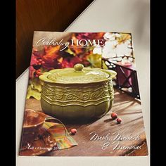 a magazine with an image of a green pot on it's cover and the words celebrating home next to it