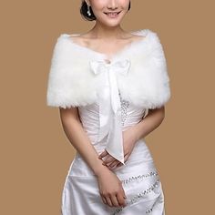 a woman in a white dress with a fur stole over her shoulder and the words ebay below it