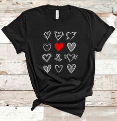 "-♥ ♥ ♥ HOW TO ORDER A TEE ♥ ♥ ♥ 1. Please, Check all Photos. 2. Select Your T-Shirt Style and Size. 3. Select Your Product Color. If you don't find your color just write me a message. I have more. 4. Choose The Quantity. 5. Click ADD TO CART and you can go back to add more items for your friends and family members. 6. Click \"Proceed to Check Out\" 7. Your Shirt will be ready to ship 3-5 Business Days. This T-shirt is perfect for Valentine`s Day, Birthday and Christmas gift. ♥ Fulfilled and pri Casual T-shirt With Heart Graphic For Gift, Black Heart-shaped Casual T-shirt, Casual Black Heart-shaped T-shirt, Black Casual Heart-shaped T-shirt, Black Heart-shaped Top With Graphic Print, Black Top With Heart Graphic As Gift, Casual Black T-shirt With Heart Shape, Valentine's Day Graphic Tee T-shirt Gift, Casual Heart Print T-shirt For Valentine's Day