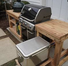 an outdoor bbq and grill on a wooden pallet